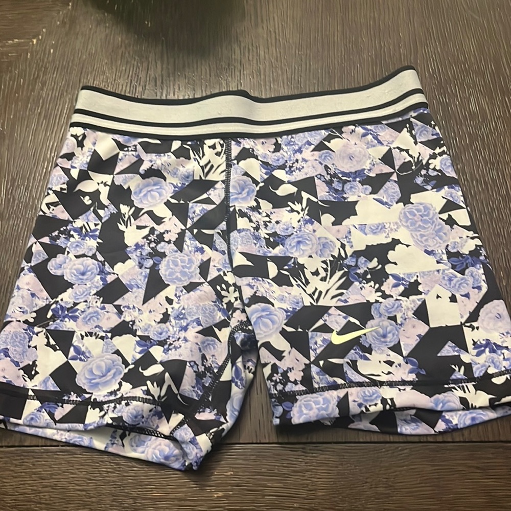 Black and purple floral print with a green Nike splash nearly worn